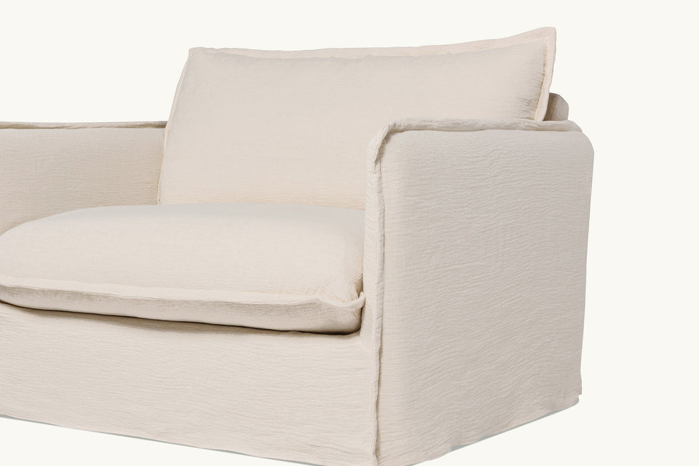 Close up view of Neva Chair in Corn Silk, a light beige Washed Cotton Linen