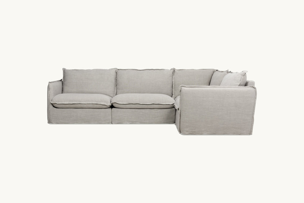 Side view of Neva L-Shape Sectional Sofa in Jasmine Rice, a light warm greige Medium Weight Linen