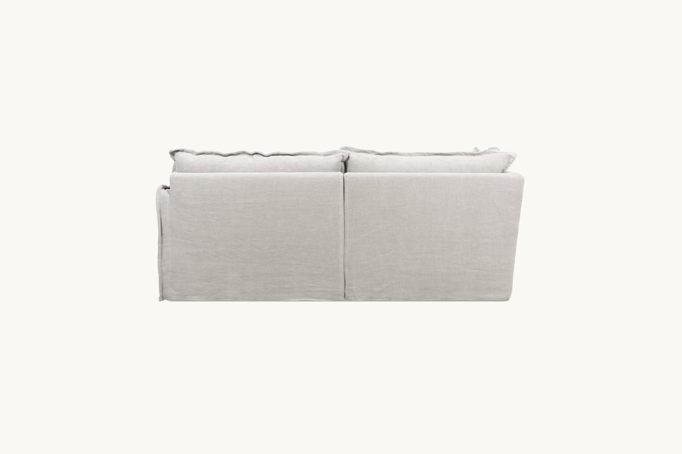 Back view of Neva L-Shape Sectional Sofa in Jasmine Rice, a light warm greige Medium Weight Linen
