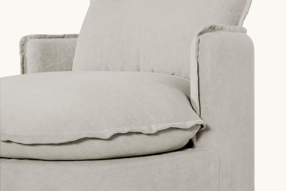 Close up view of Neva Round Daybed in Jasmine Rice, a light warm greige Medium Weight Linen
