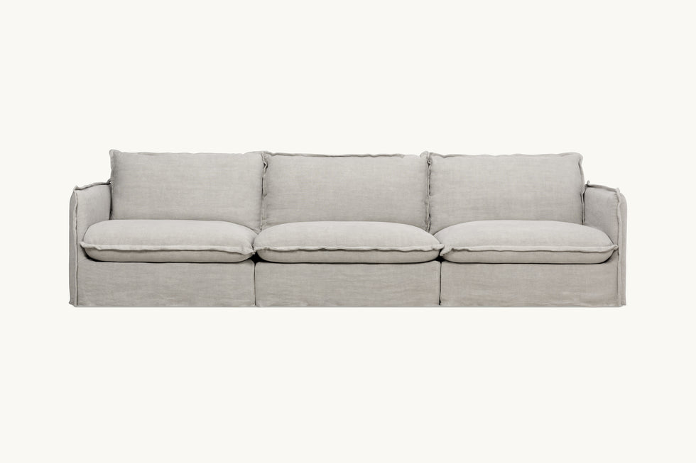 Front view of Neva Sectional Sofa in Jasmine Rice, a light warm greige Medium Weight Linen
