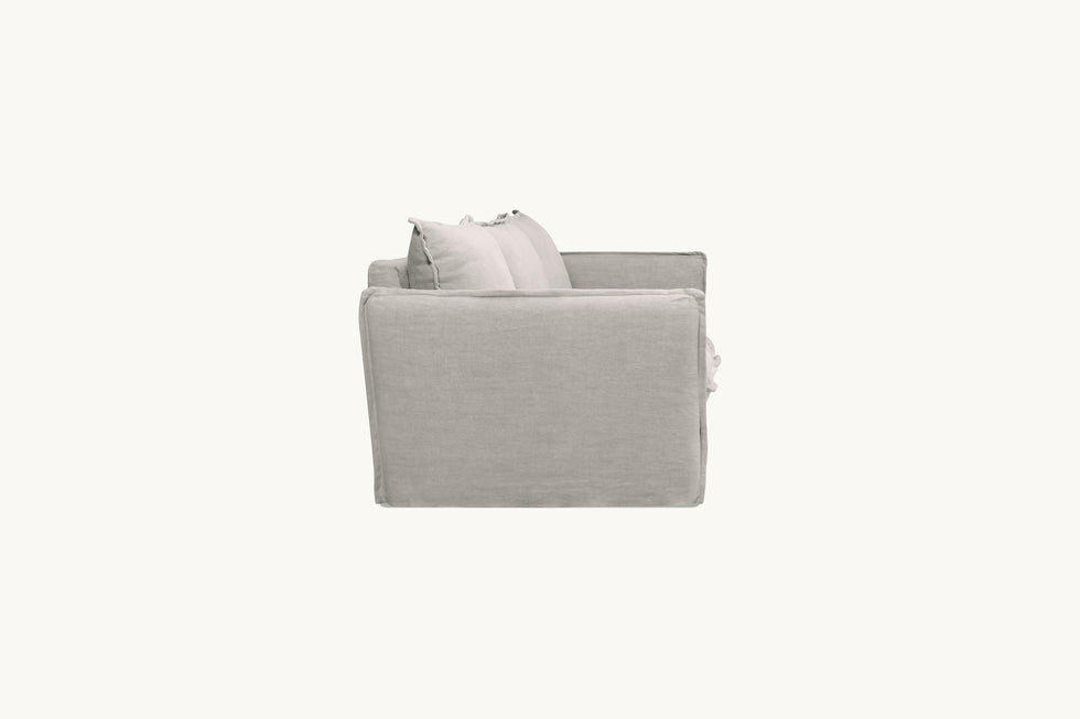 Side view of Neva Sectional Sofa in Jasmine Rice, a light warm greige Medium Weight Linen