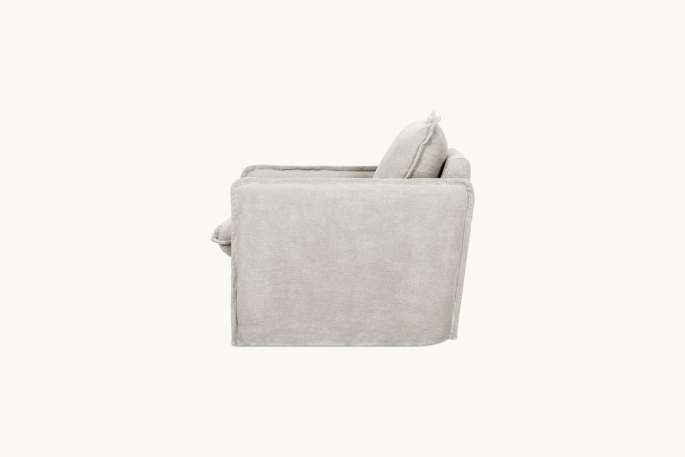 Side view of Neva Swivel Glider Chair in Jasmine Rice, a light warm greige Medium Weight Linen