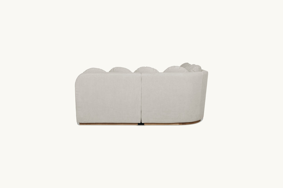 Back view of Olea Short Corner Sectional Sofa in Jasmine Rice, a light warm greige Medium Weight Linen