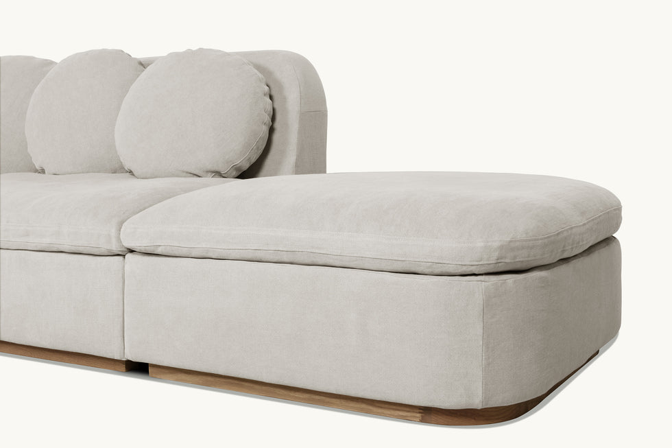 Close up view of Olea L-Shape Sectional Sofa in Jasmine Rice, a light warm greige Medium Weight Linen