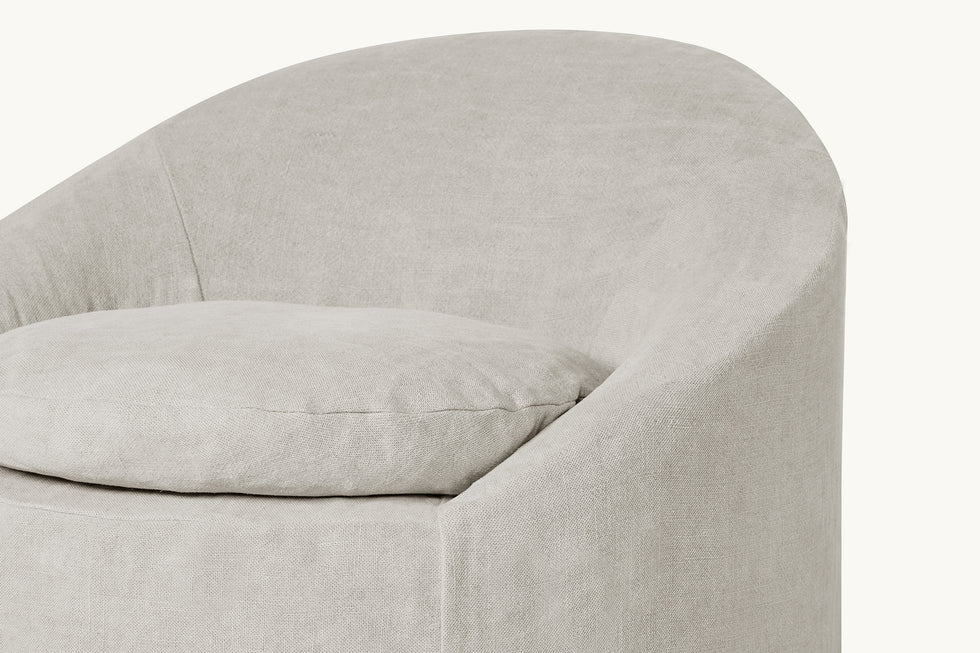 Close up view of Ozzi Chair in Jasmine Rice, a light warm greige Medium Weight Linen