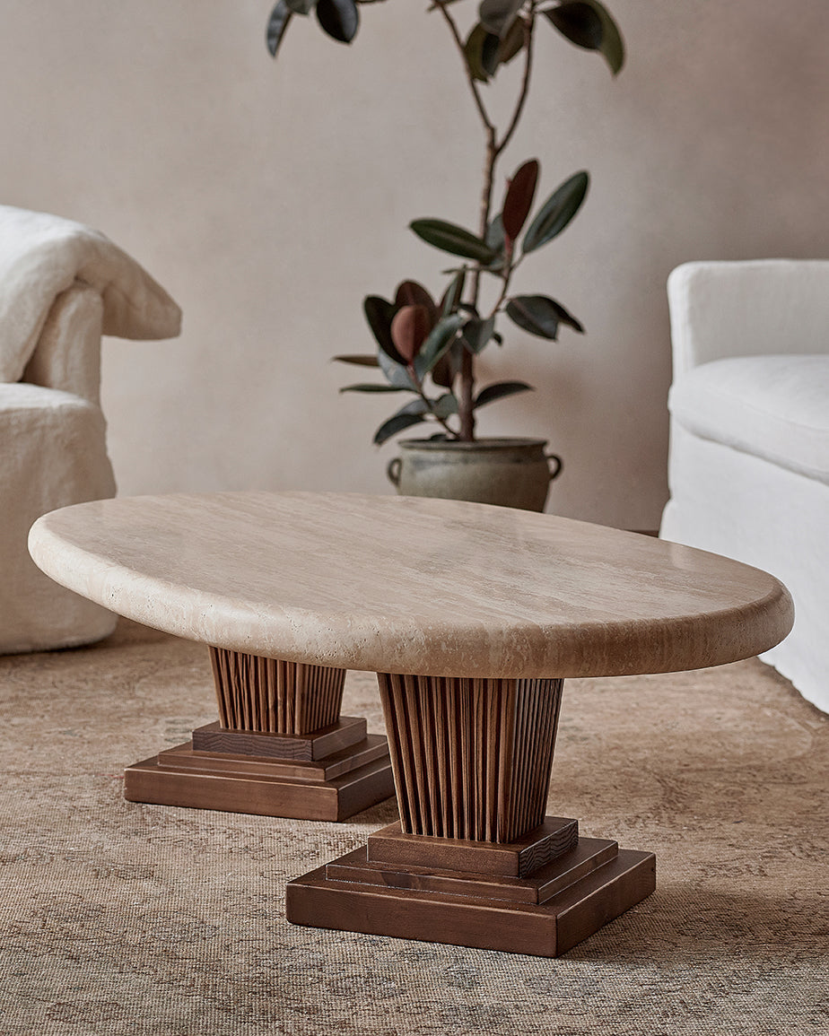 Cordelia Coffee Table with a warm beige Galata Travertine tabletop and carved and tapered Reclaimed Pine legs