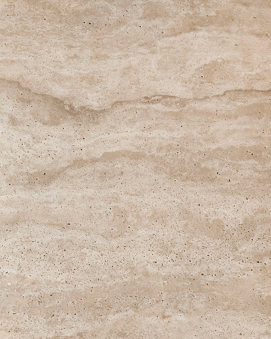 Swatch of Turkish Galata Travertine, in a warm beige with gold and pink undertones. Various veining, color variations, and pitting throughout
