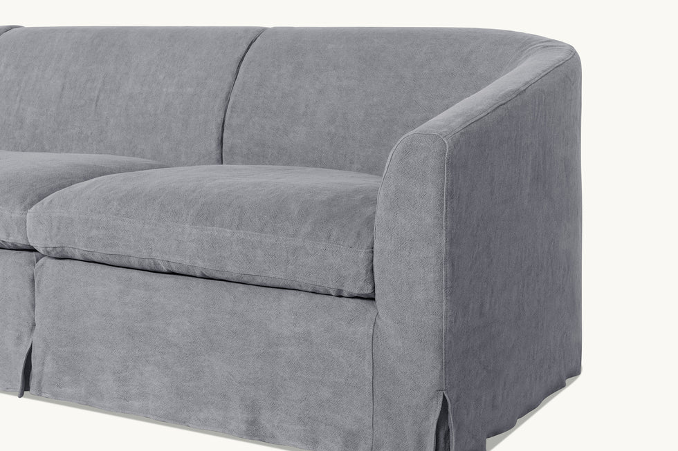 Close up view of Ziki L-Shape Sectional Sofa in Ink Cap, a medium cool grey Light Weight Linen